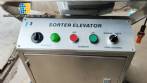 Elevador de clasificaci�n de c�psulas de acero inoxidable Elevador clasificador ACG Pam