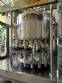 Llenadora rotativa de acero inoxidable con 16 boquillas IMSB para botellas y frascos