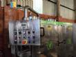 Llenadora rotativa gravimtrica de acero inoxidable con cabina