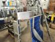 Elevador de posicionamiento y llenado de tapas para la industria de maquinaria SLP